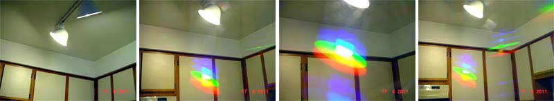 Свет от энергосберегающей лампы через очки с дифракционными решетками вместо стекол.